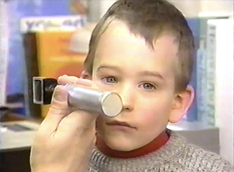 Boy having his right ear examined with an otoscope.